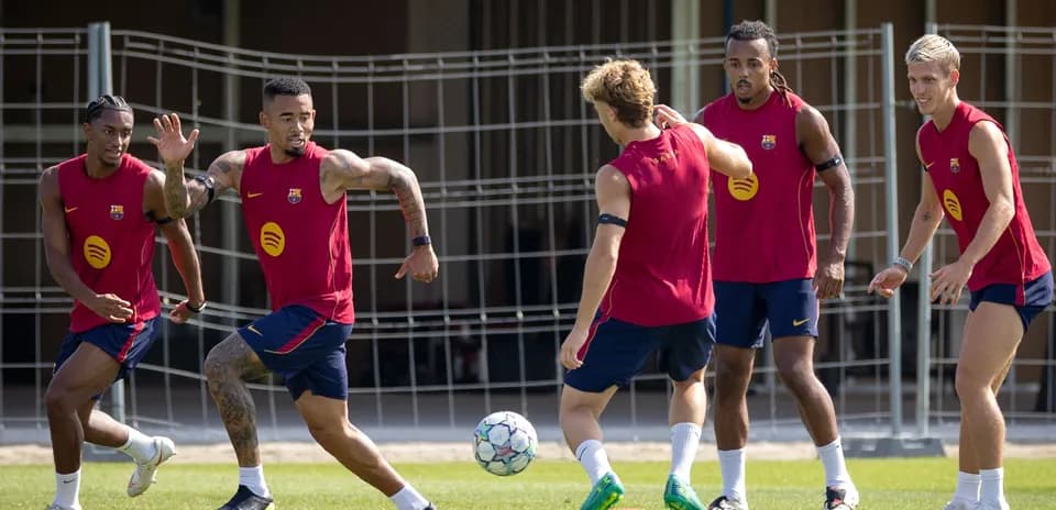 Barcelona players training and playing with a ball
