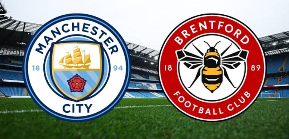 Manchester City and Brentford club logos on pitch