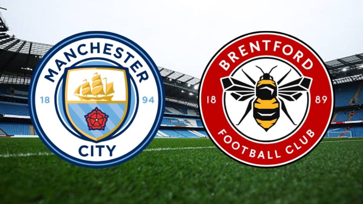 Manchester City and Brentford club logos on pitch