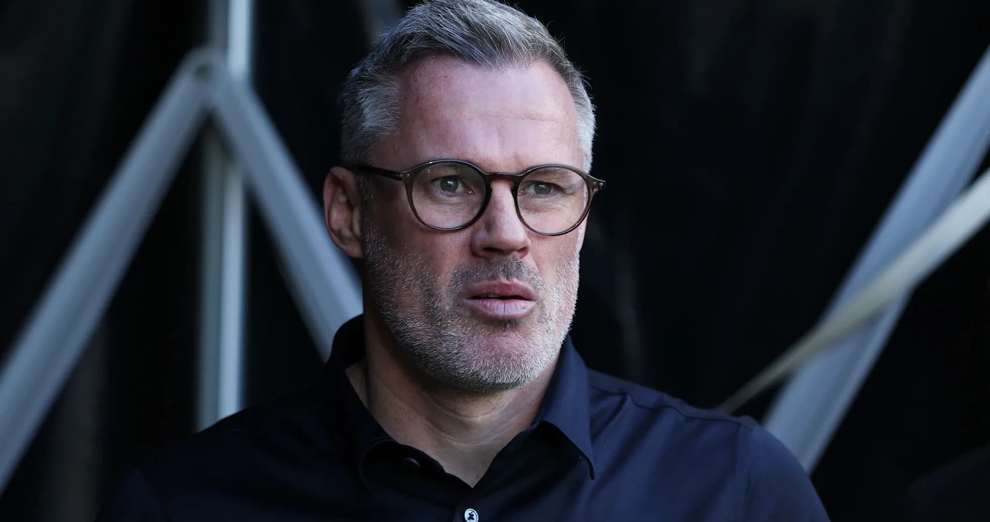 Person with glasses in a dark shirt