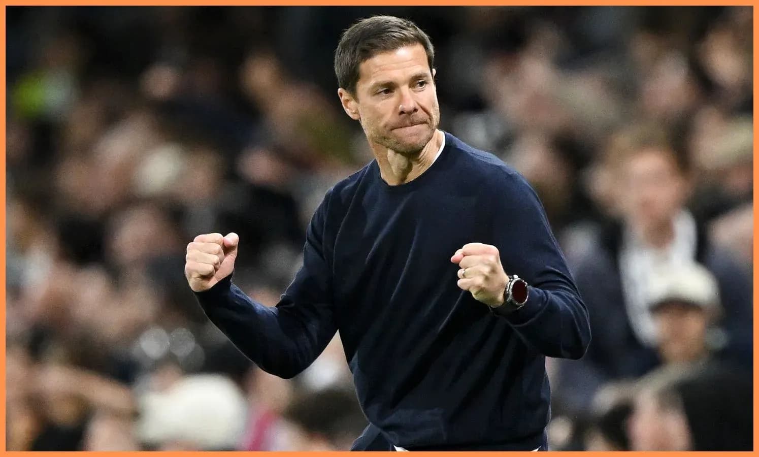 Coach celebrating during a match on the sidelines