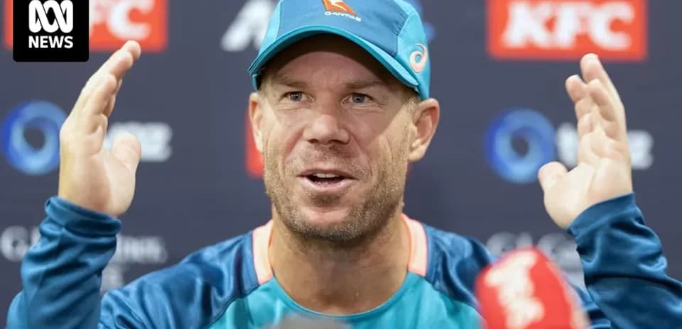 Cricketer speaking at press conference with gestures