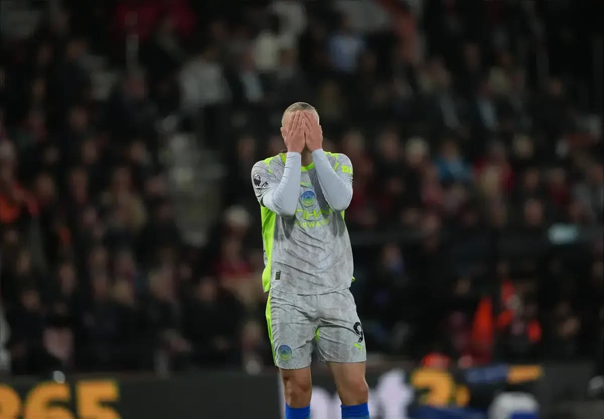 Goalkeeper covering face after conceding a goal