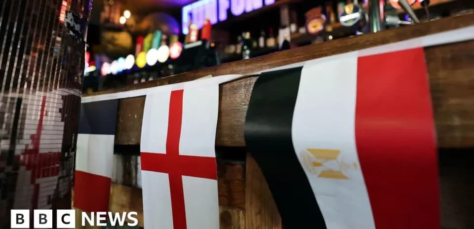 Flags of France, England, and Egypt in bar
