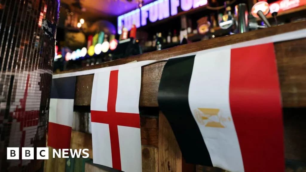 Flags of France, England, and Egypt in bar