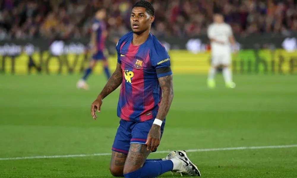 Barcelona player kneeling on pitch during match