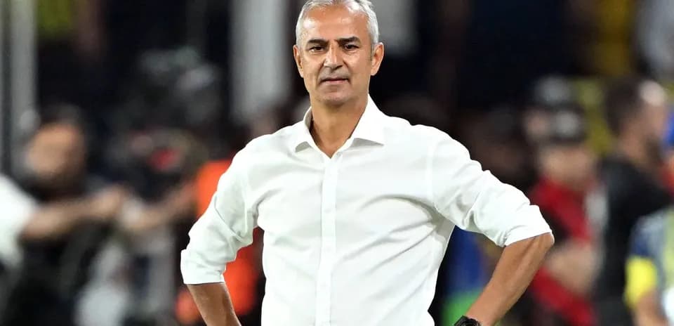 Football coach observing match from sidelines