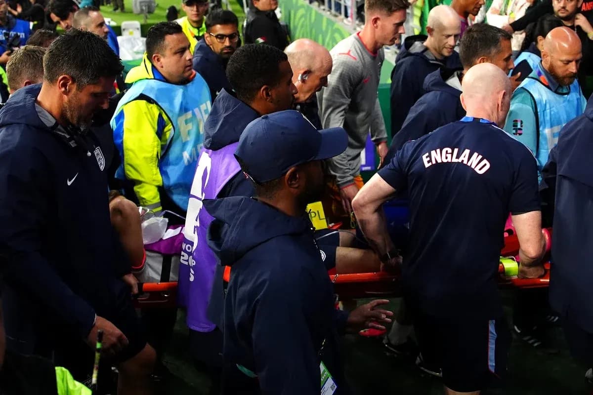 Medical staff attending to player on stretcher