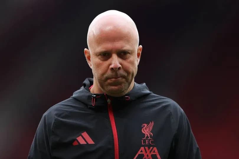 Liverpool coach on the pitch before match