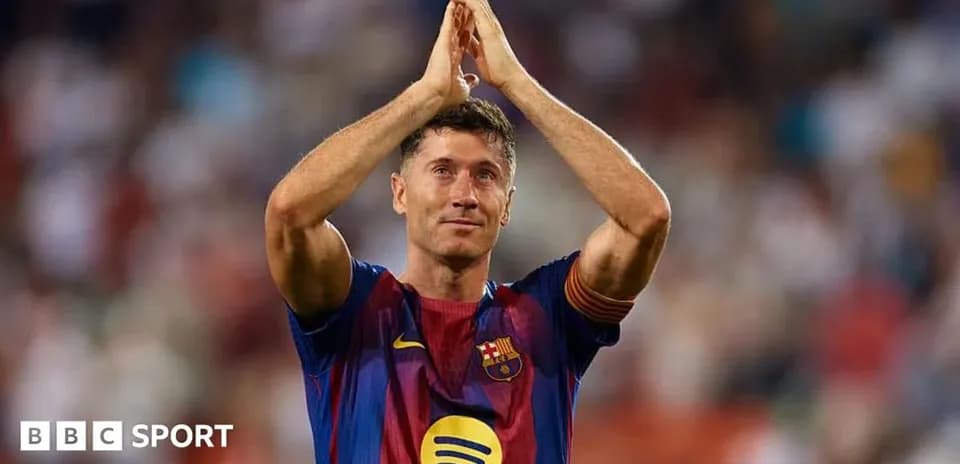 Robert Lewandowski applauding fans after match