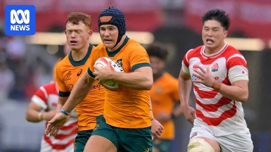 Aussie player running with the rugby ball against Japan