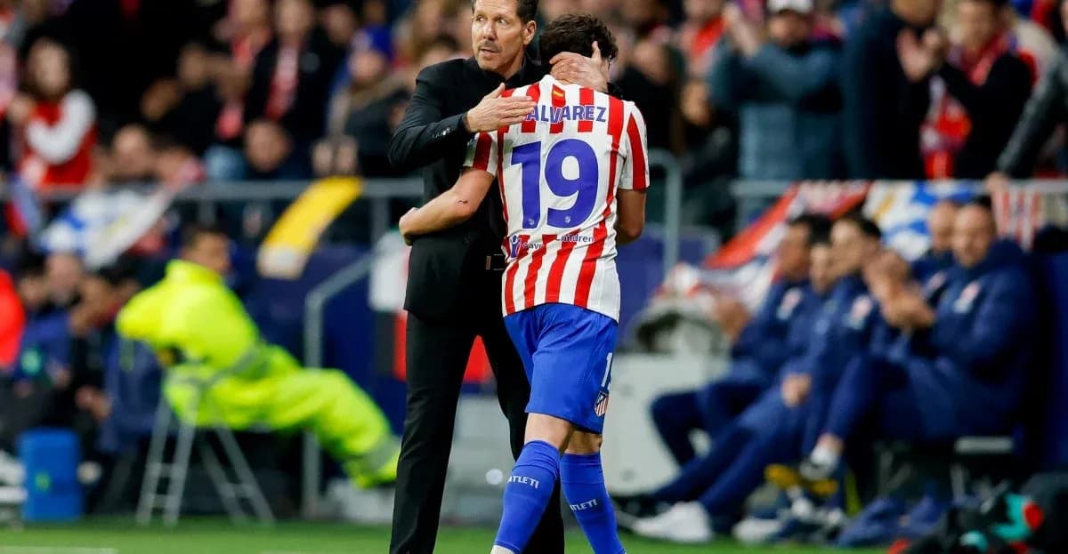 Coach hugging player during match celebration