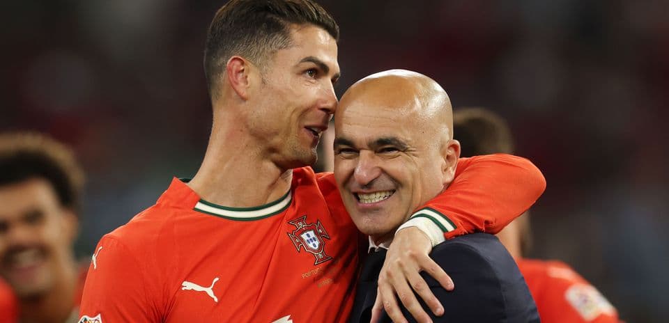 Cristiano Ronaldo and coach celebrating after match