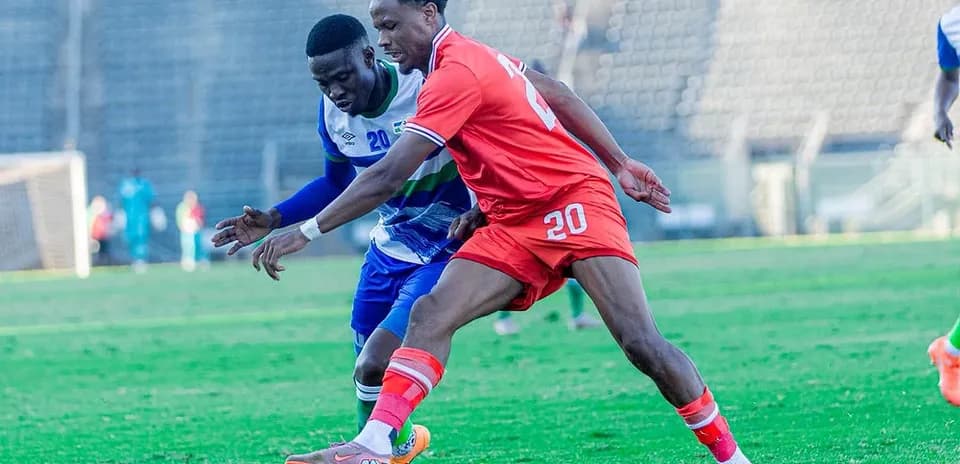 Two players competing for the ball during match