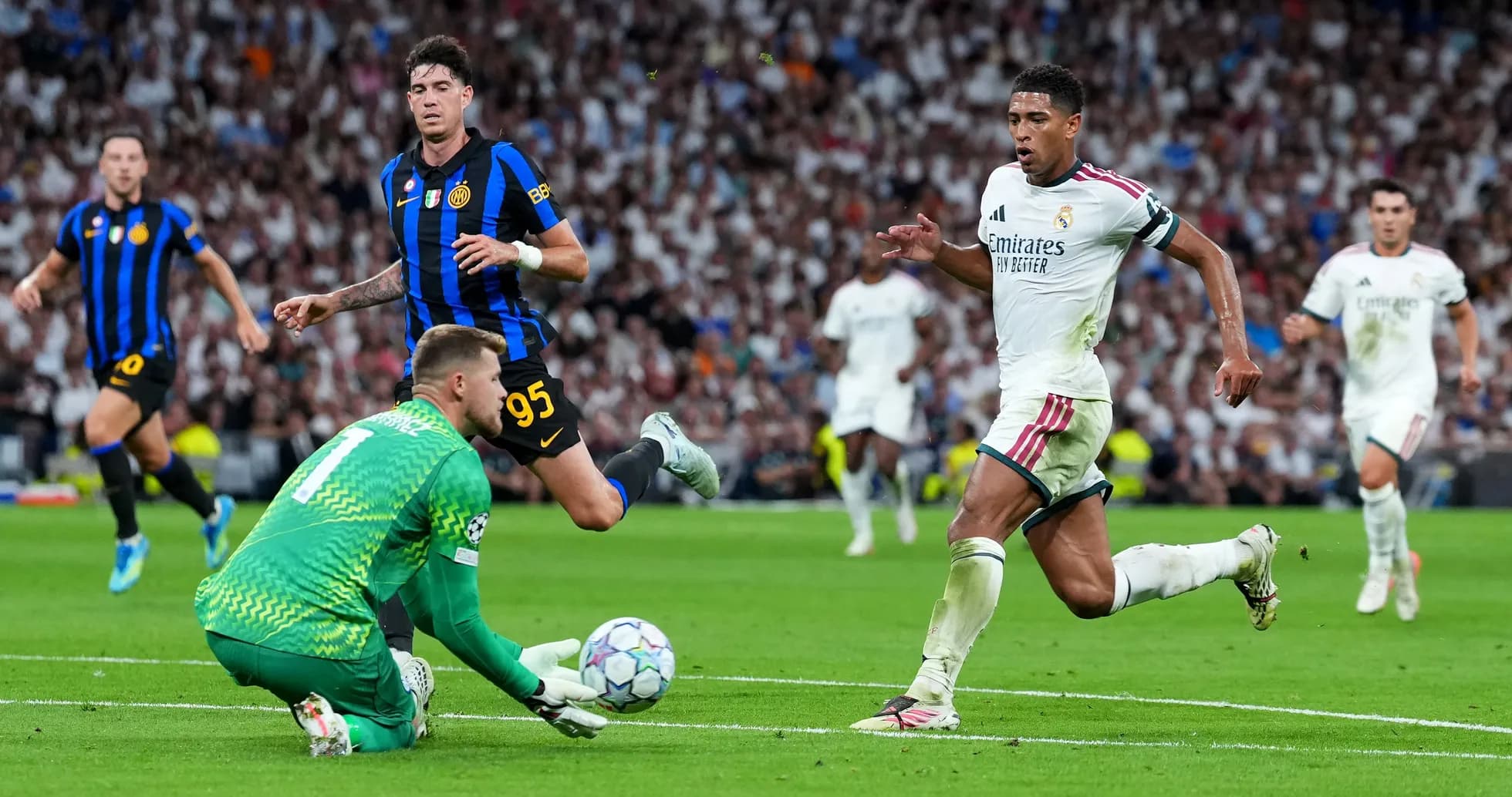 Real Madrid player running past goalkeeper during match