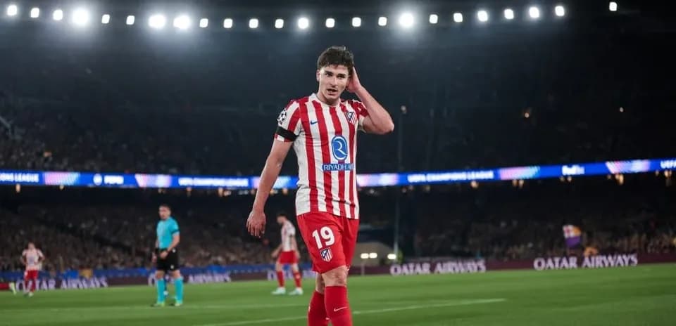 Atletico Madrid player walking on the pitch during match