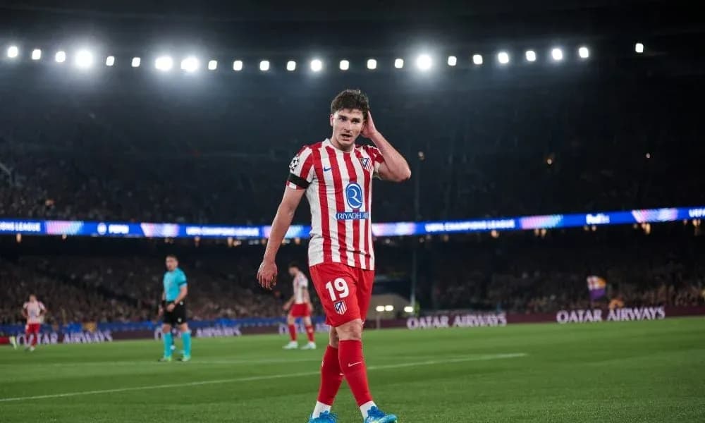 Atletico Madrid player walking on the pitch during match