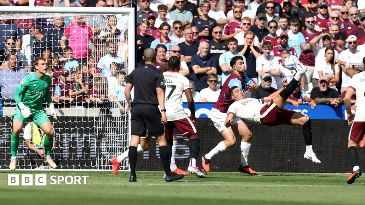 Player attempting overhead kick during football match