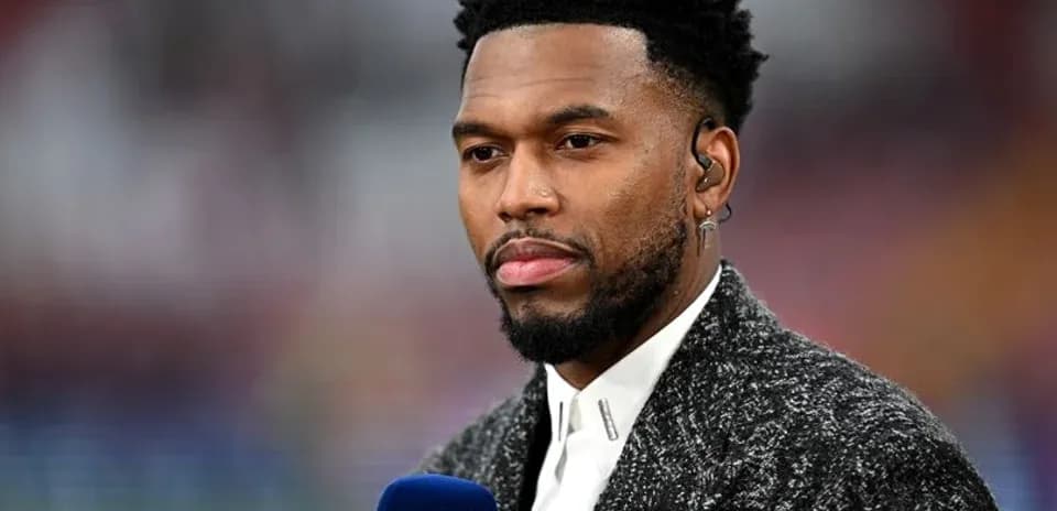 Sportscaster speaking into microphone before match