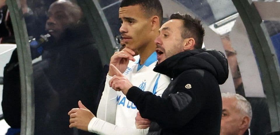 Coach instructing player on the sidelines during match