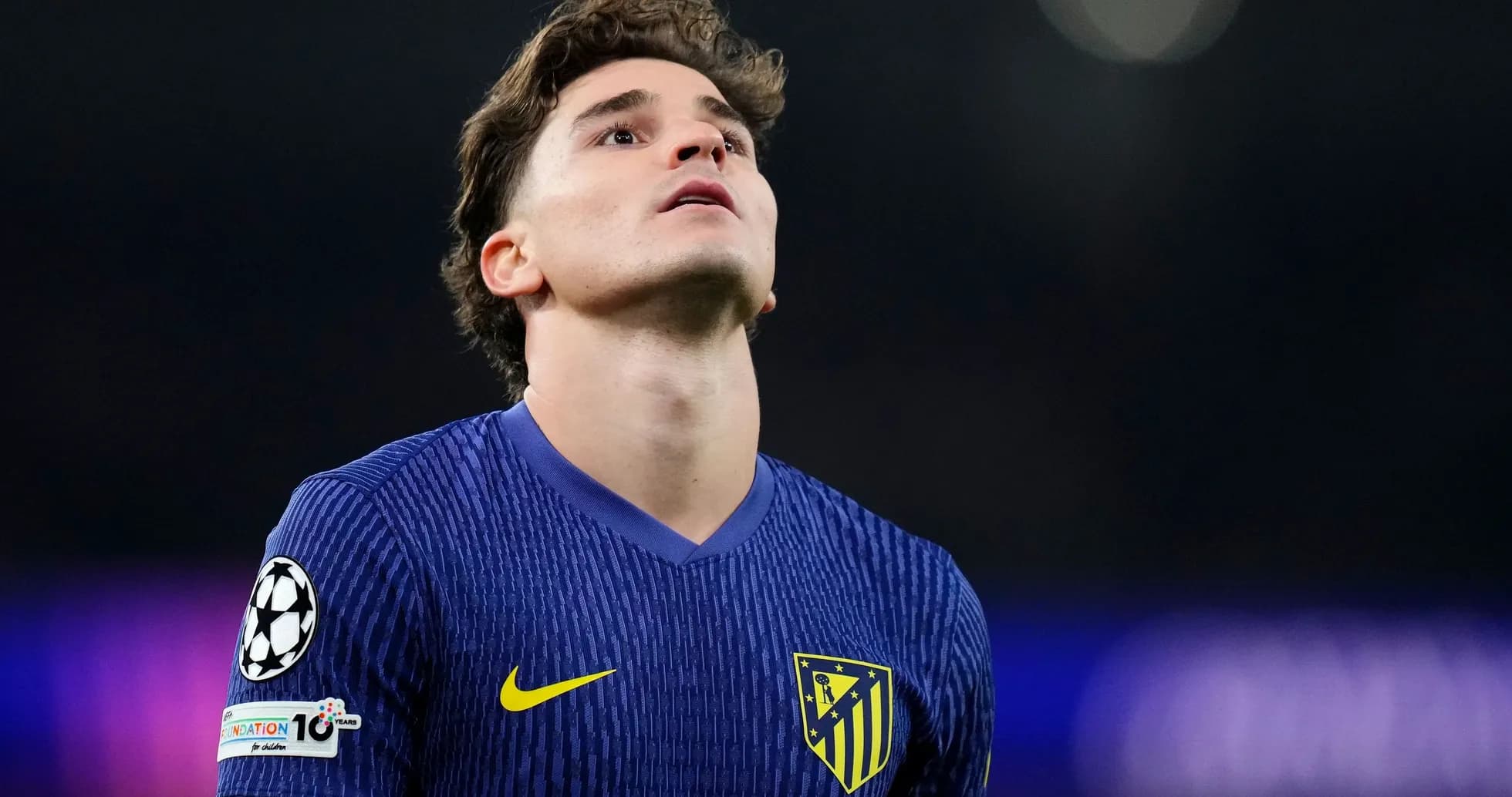 Atletico Madrid player looking up during match