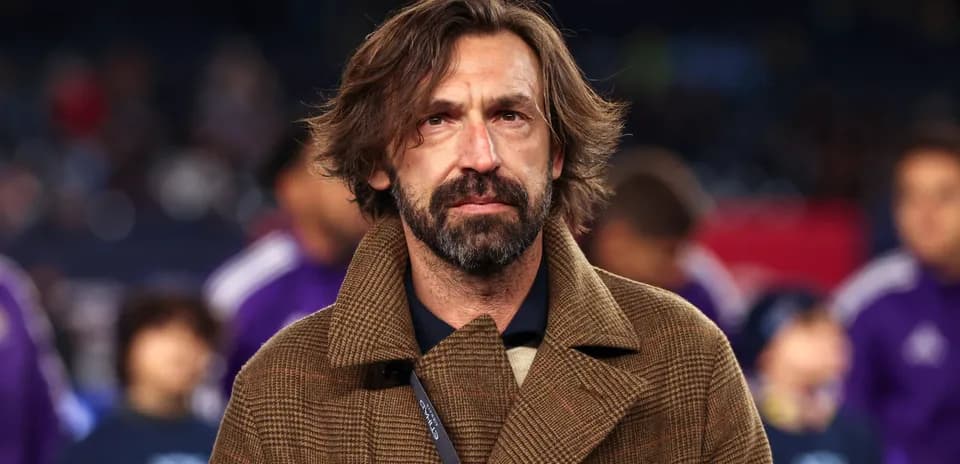 Coach on field during match preparations