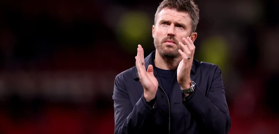 Men's football coach applauding after the match