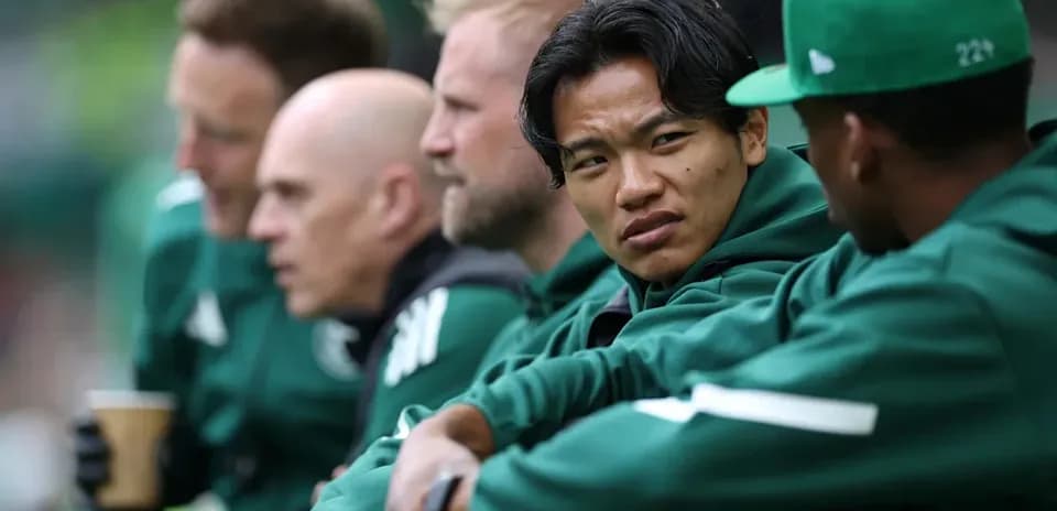 Players sitting on the bench during a match