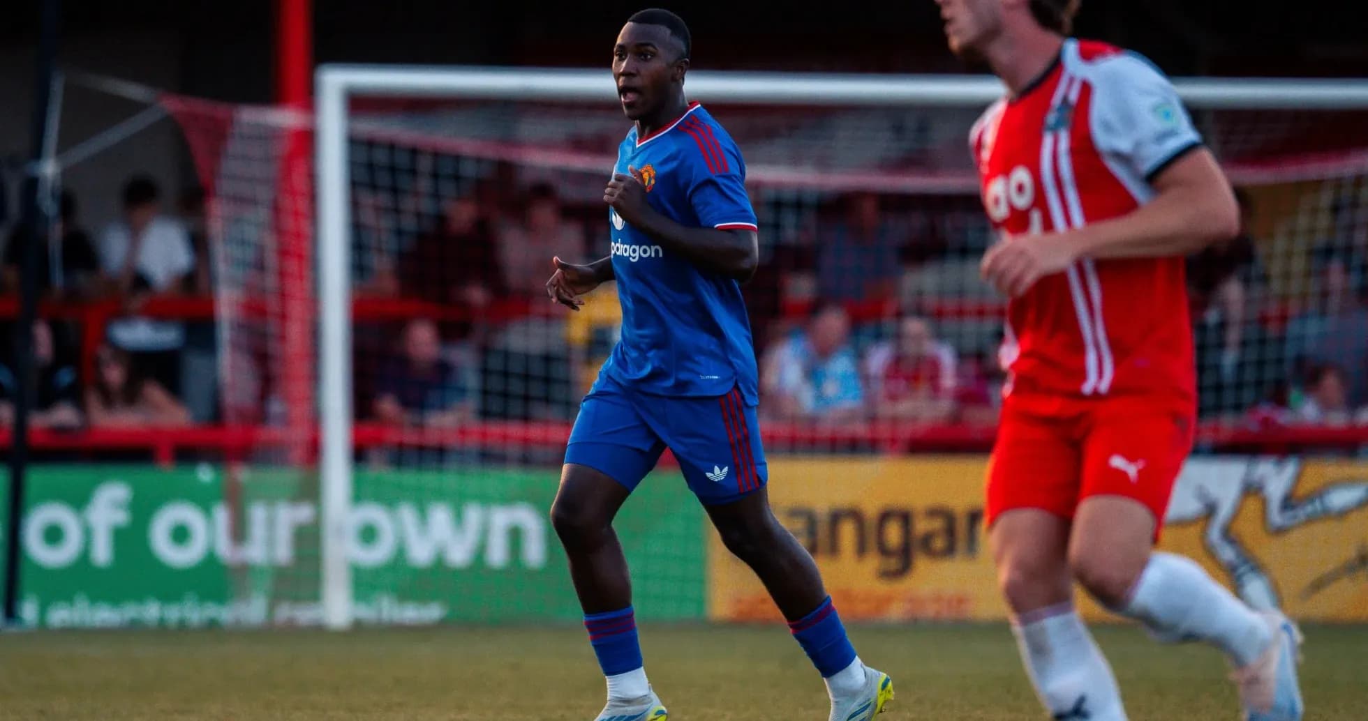 Player running on the pitch during match action