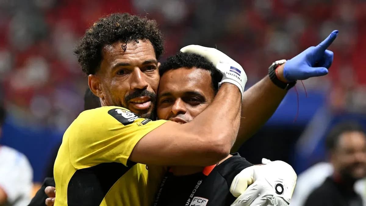 Goalkeeper celebrating with staff after match