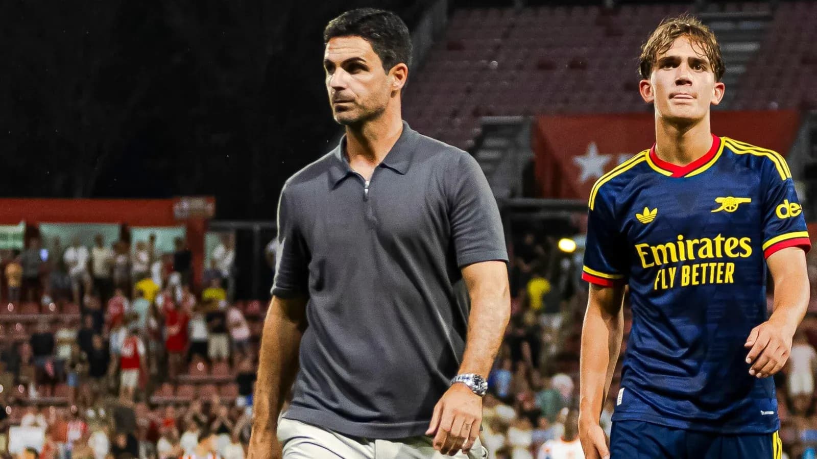 Arsenal manager and player walking off the pitch