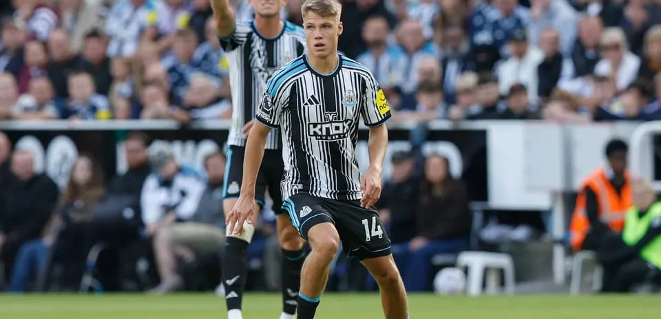 Newcastle player controlling ball during match action