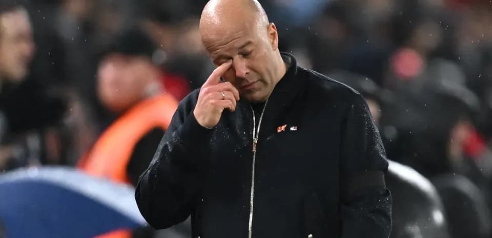 Coach wiping his face during a match