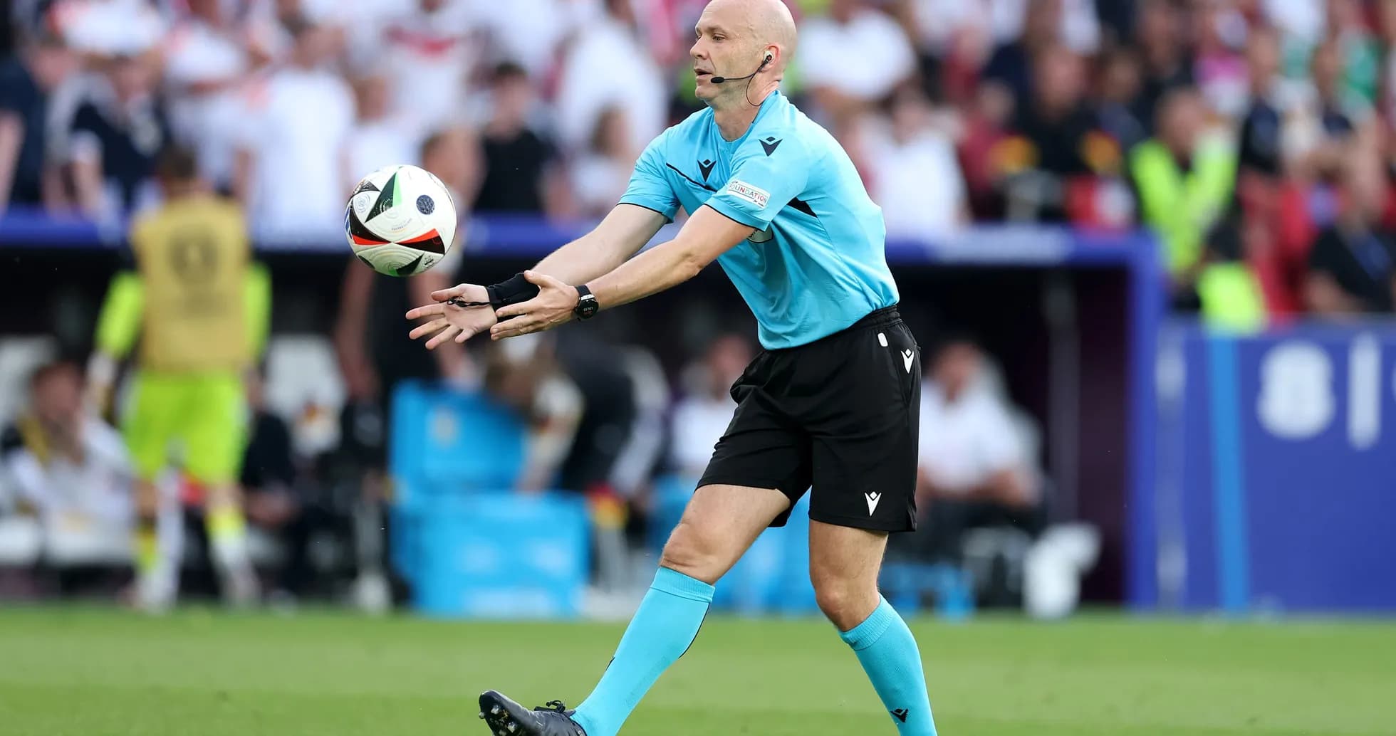 Referee signaling during a football match