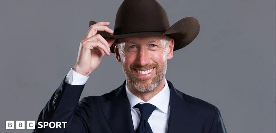 Man in suit wearing a cowboy hat