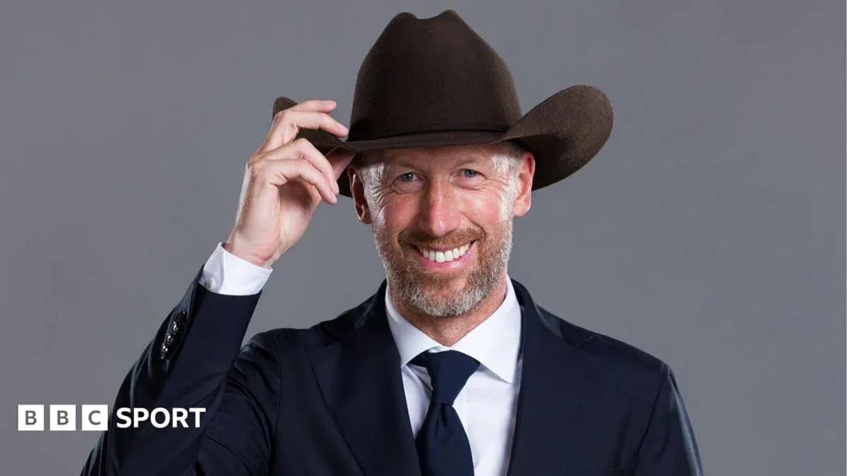 Man in suit wearing a cowboy hat