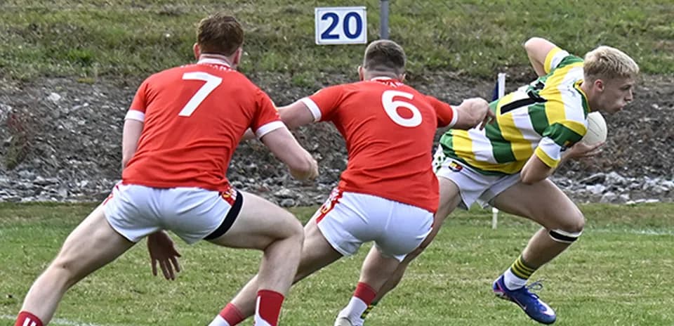 Player in green and yellow jersey evading two opponents