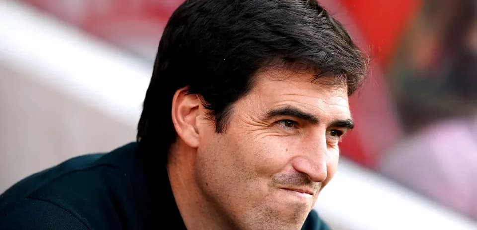 Football manager observing from the sidelines