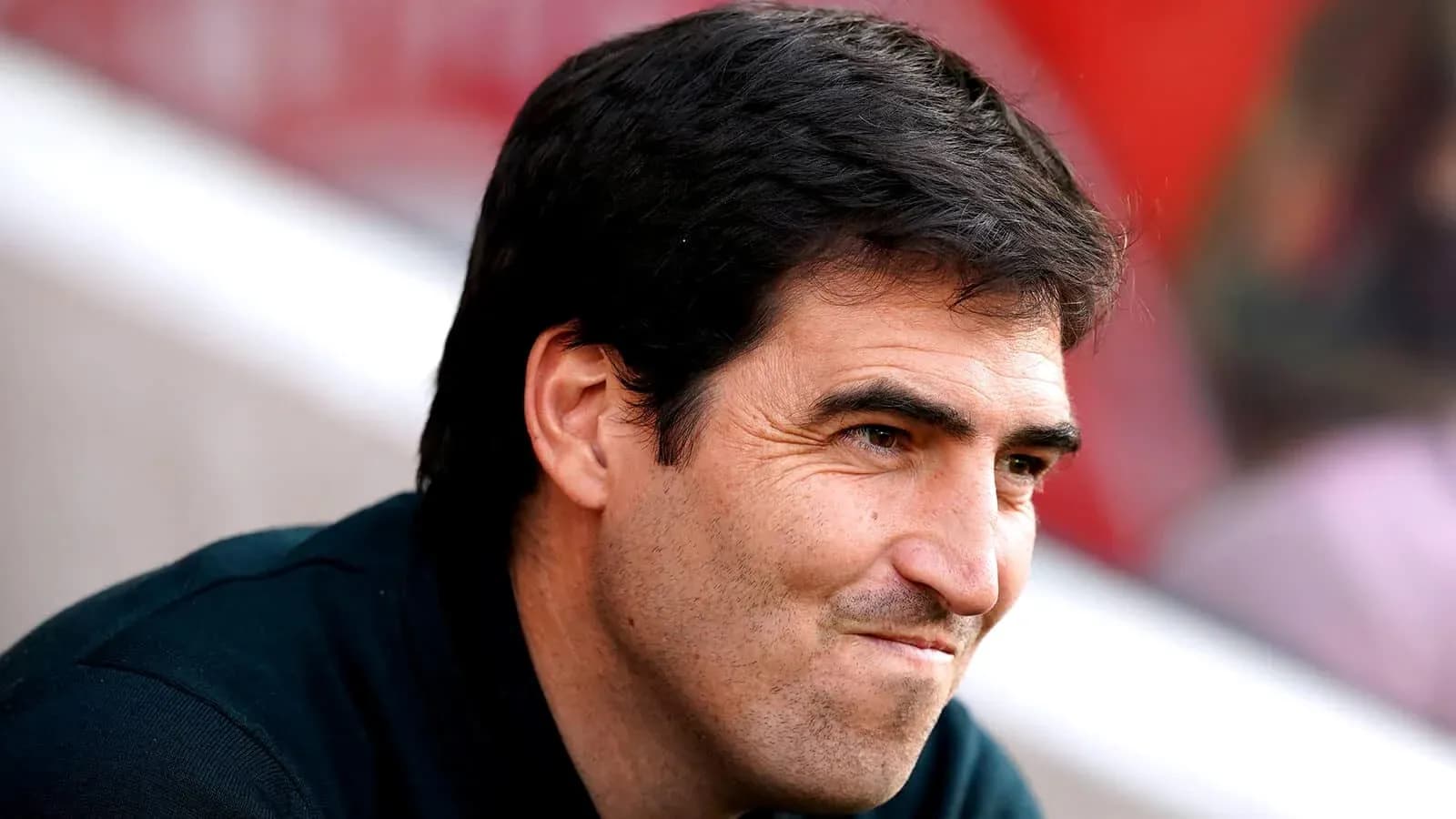Football manager observing from the sidelines