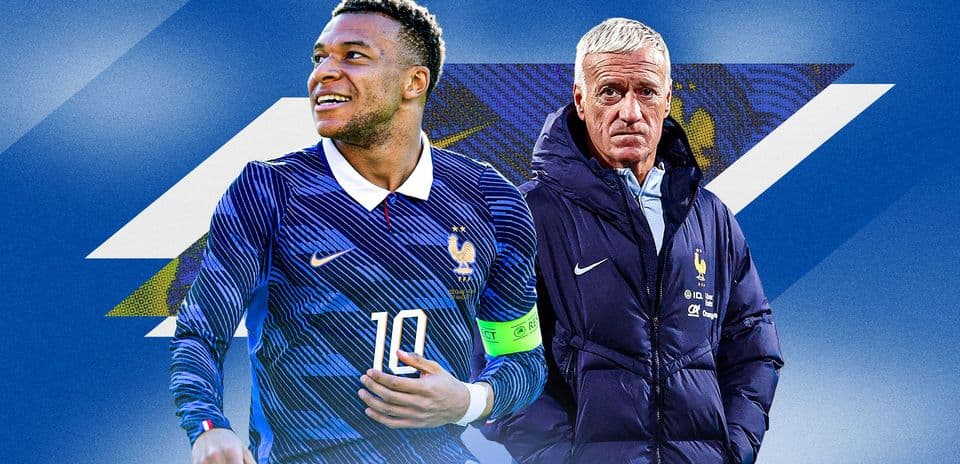Kylian Mbappé and Didier Deschamps posing together