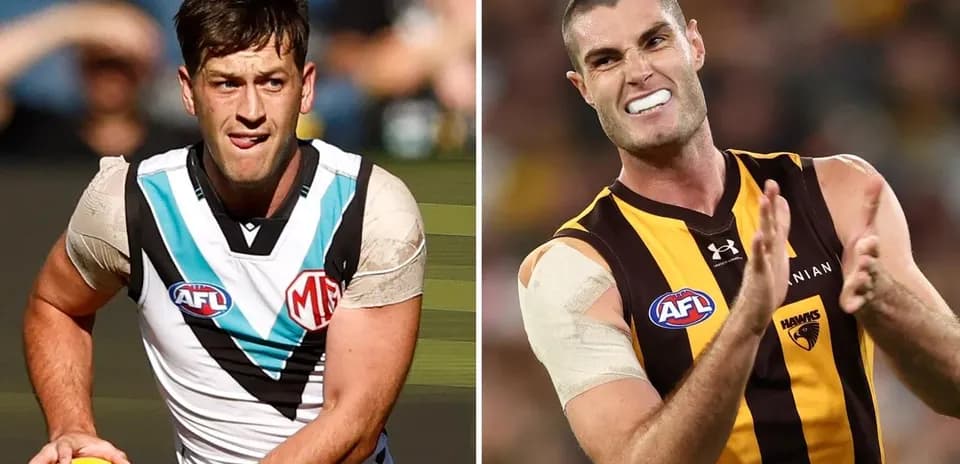 Two AFL players in action during a match