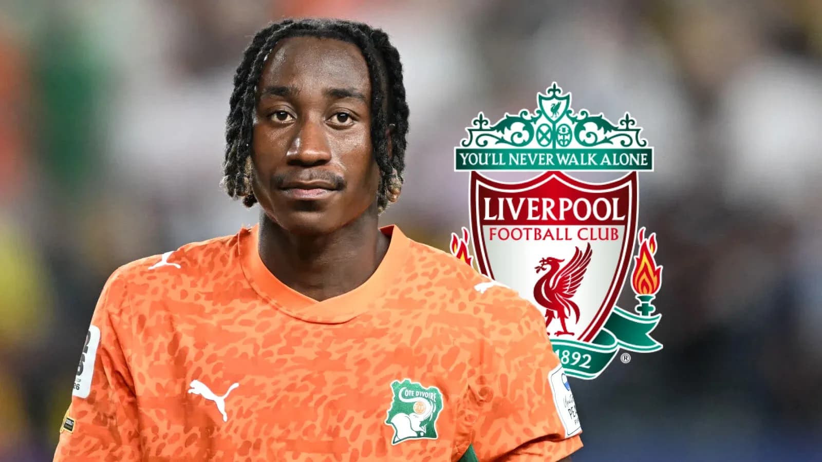 Goalkeeper in orange kit with Liverpool logo