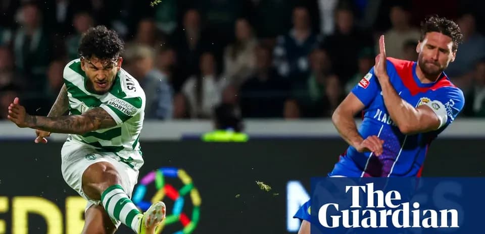 Player kicking ball during football match action