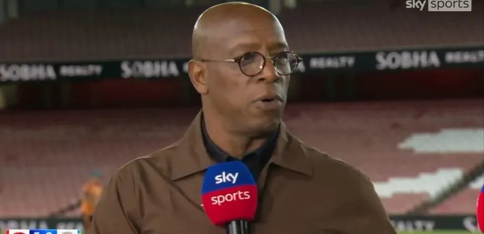 Analyst speaking during post-match segment at stadium