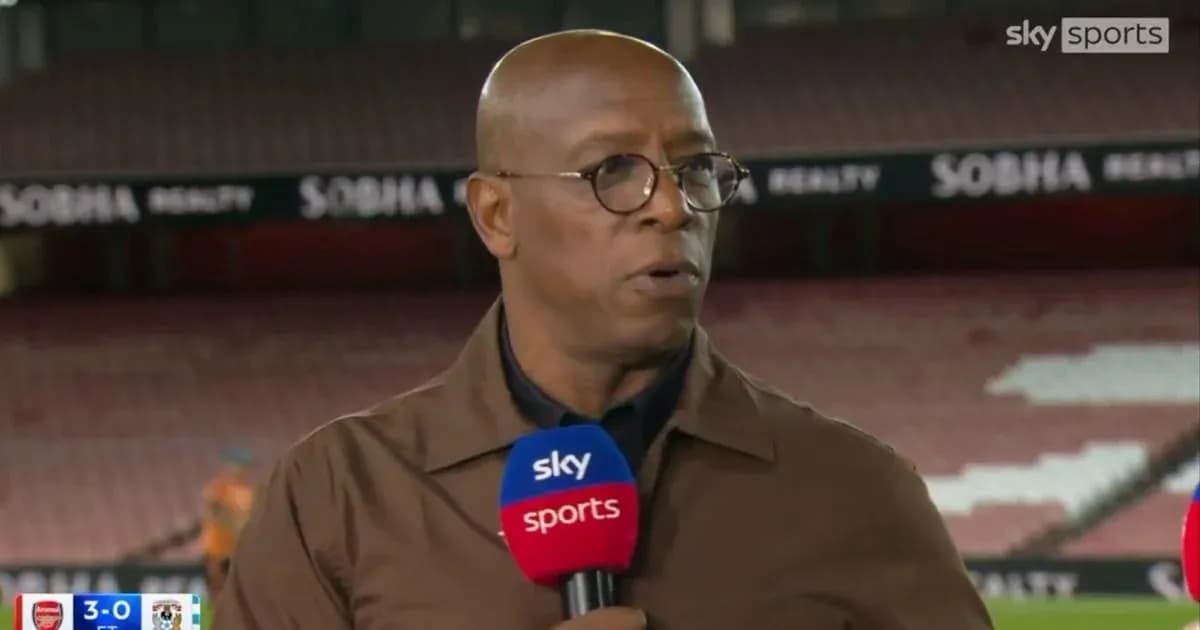 Analyst speaking during post-match segment at stadium