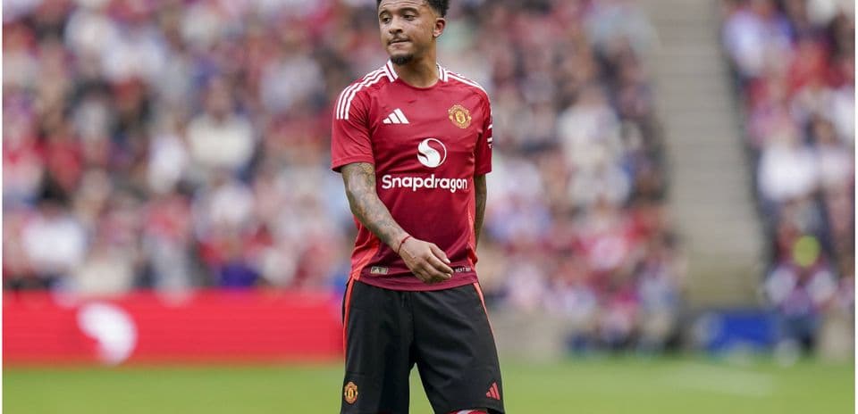 Jadon Sancho wearing Manchester United kit during match