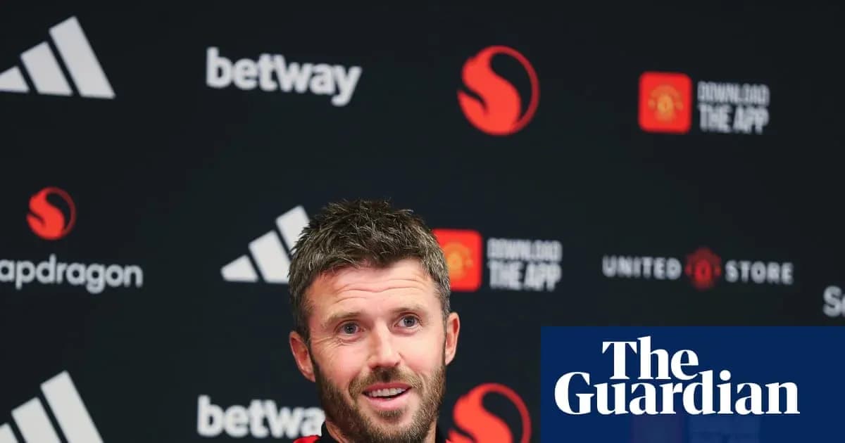 Men's football manager speaking at press conference