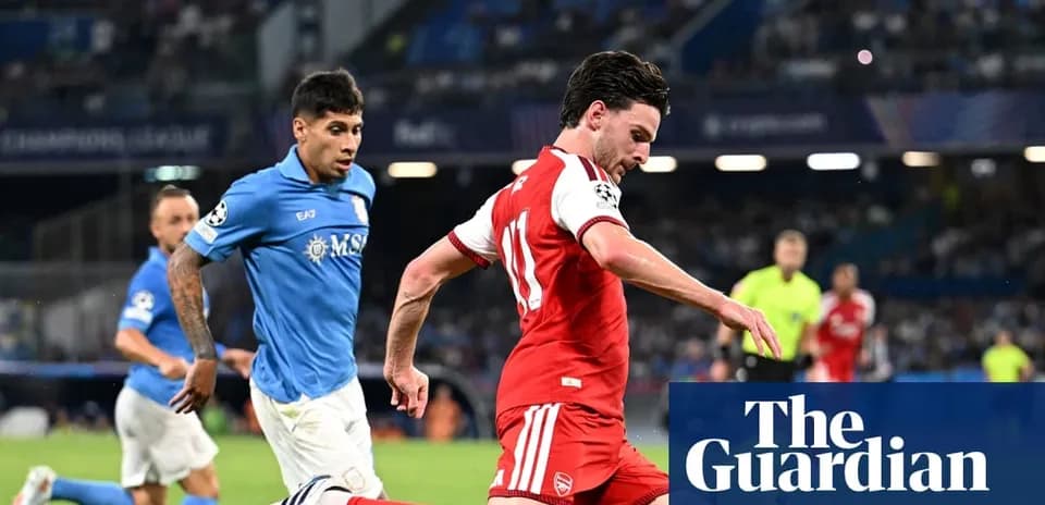 Arsenal player dribbling past opposing team during match