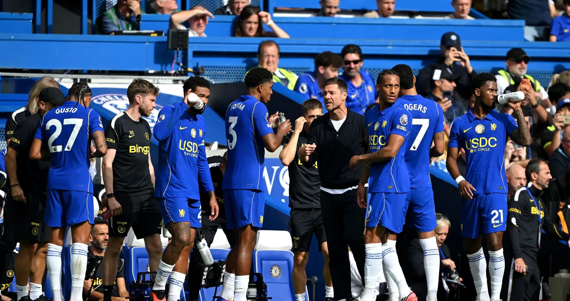 Chelsea players on the bench during a match