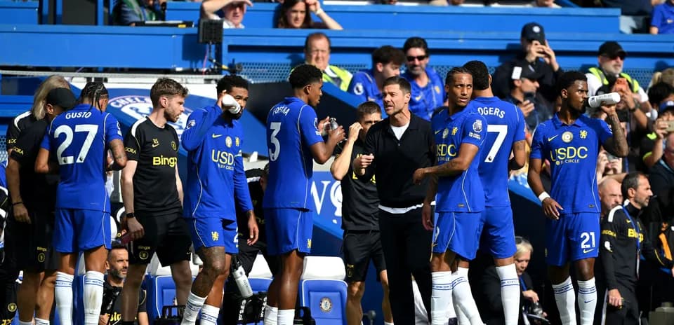 Chelsea players on the bench during a match
